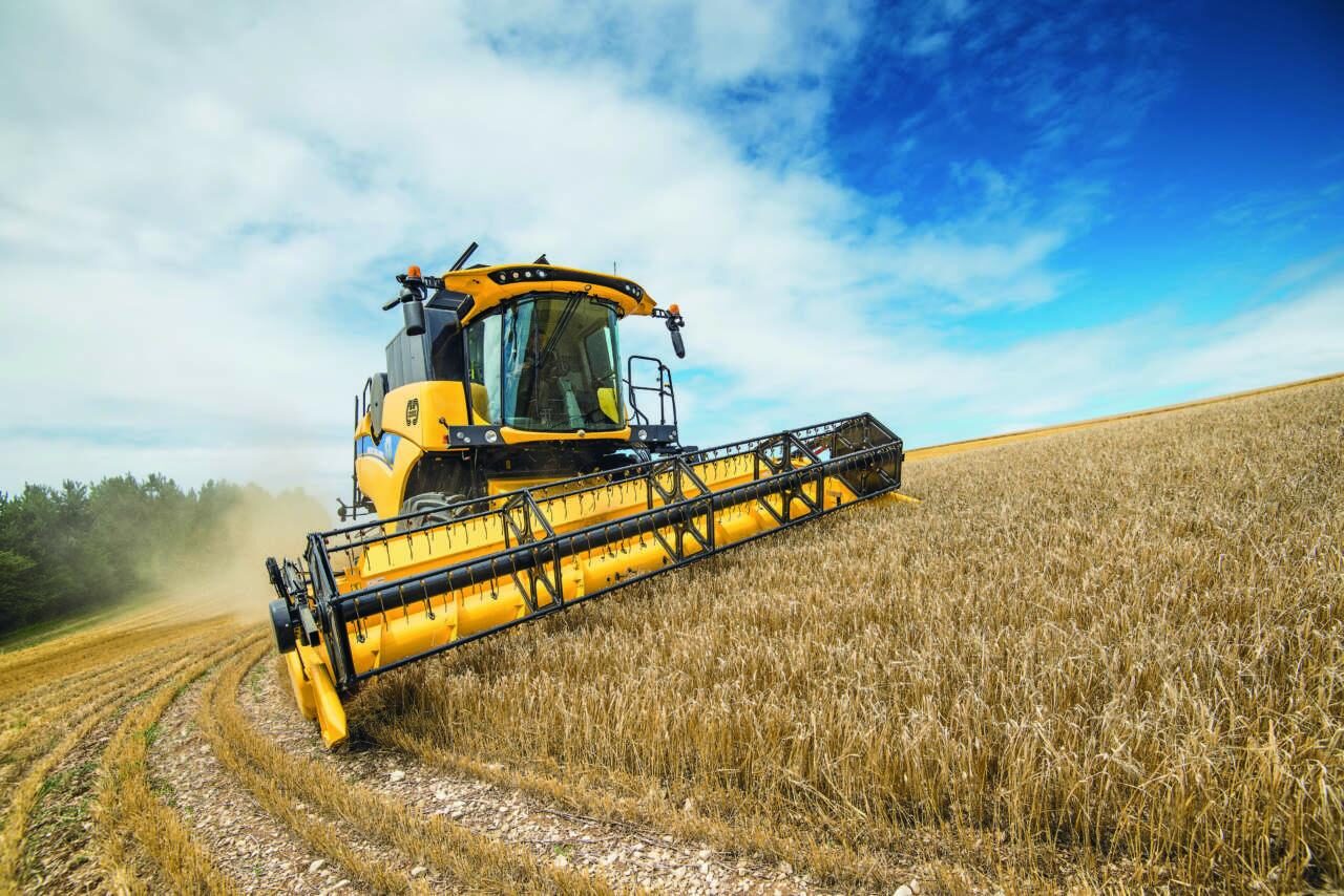 Agricultural harvesting machinery operating in a field